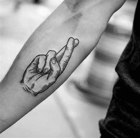 small fingers crossed tattoo|evil smile tattoo cross hand.